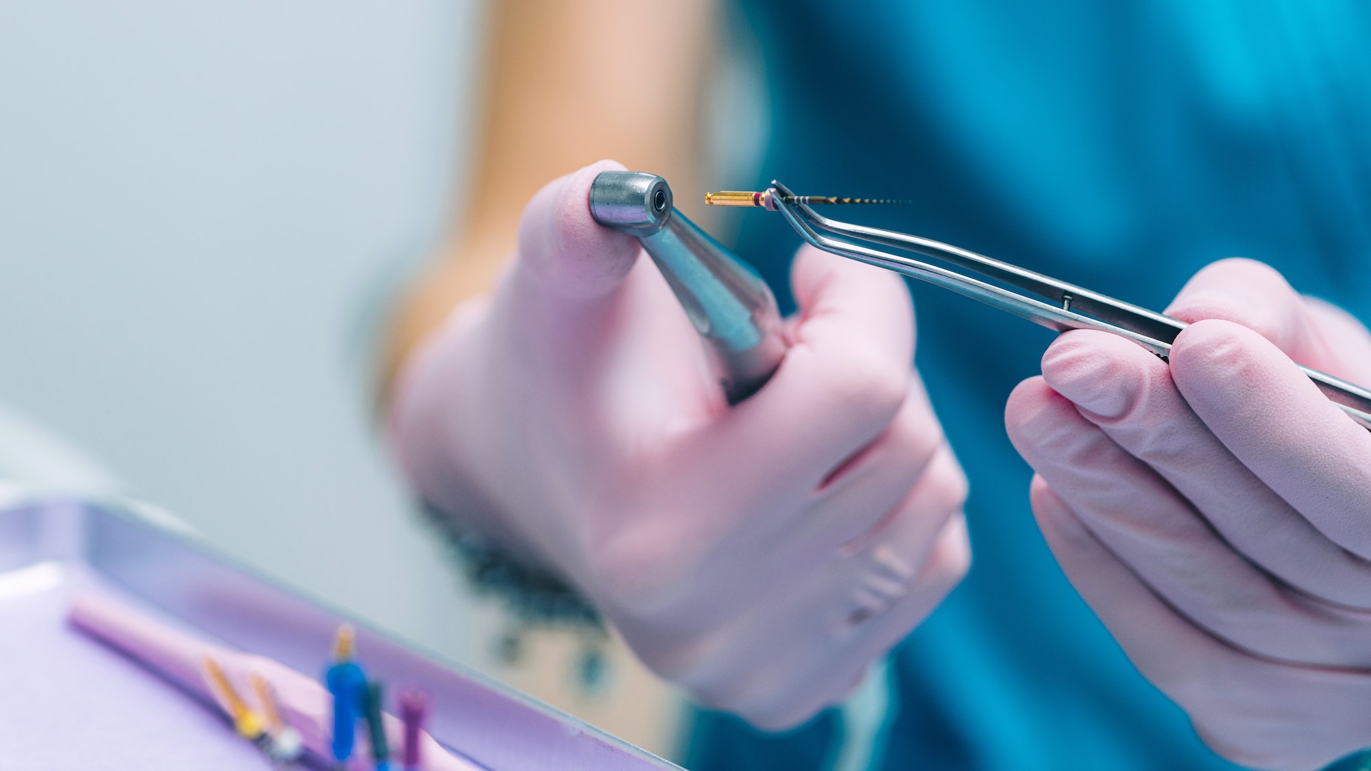 An Endodontist Holding Barbed Broach, Root Canal Treatment in Dental Clinic.