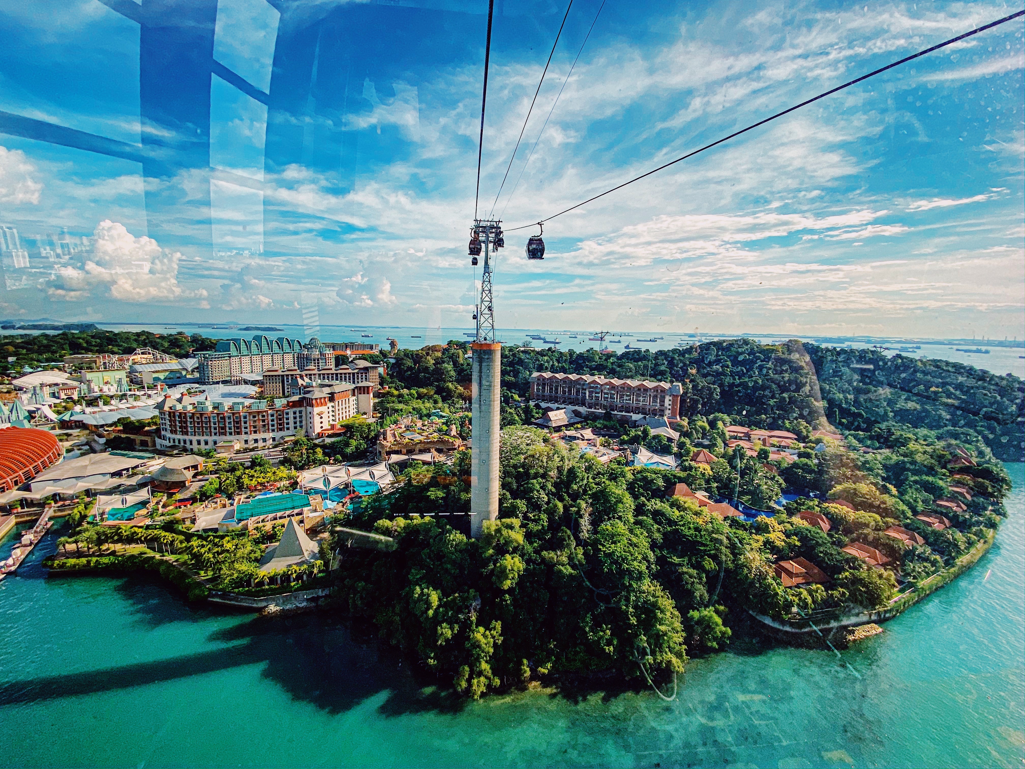 Wide angle View from cable car connecting Singapore mainland to Sentosa Island