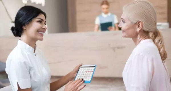 Why do people travel abroad for a smile makeover?